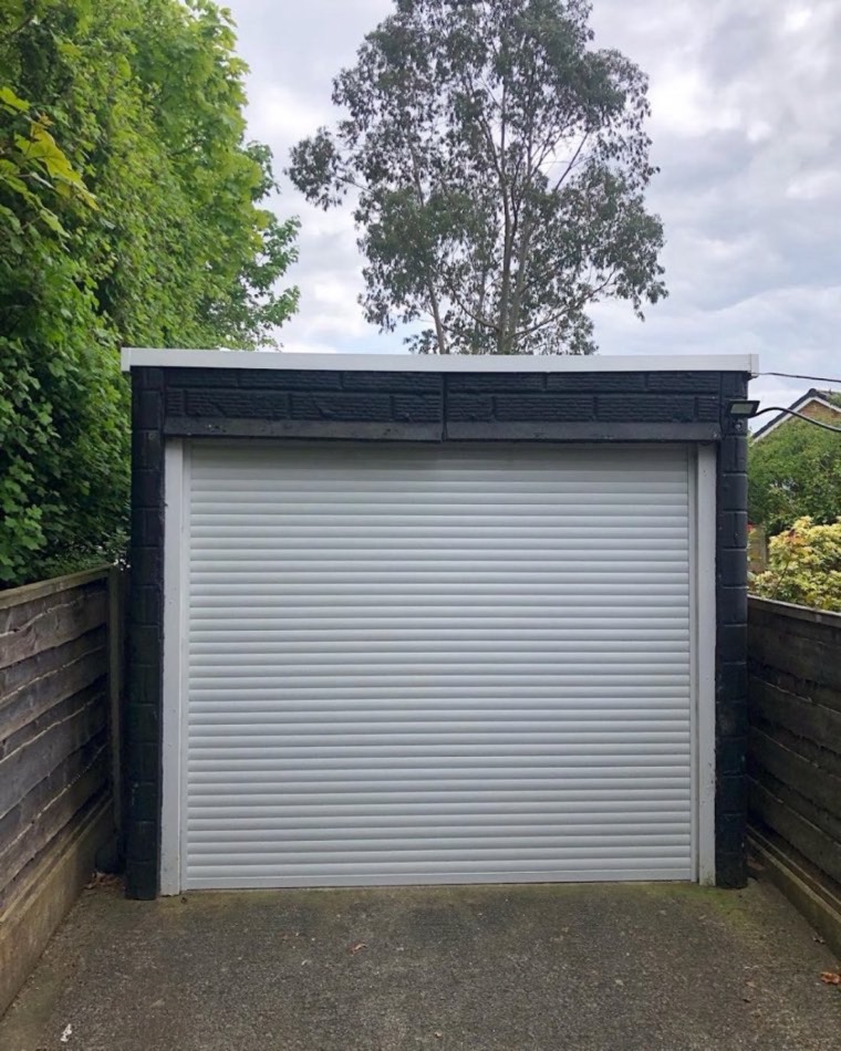 White roller garage door supplied and fitted by Arthur's Doors